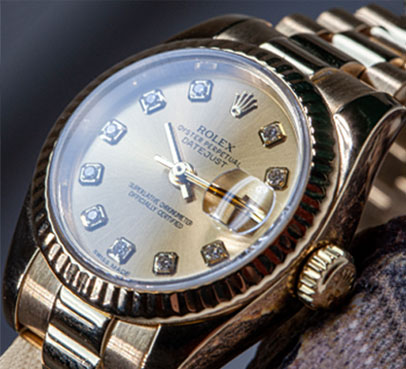 Gold watch with diamond-set dial after polishing